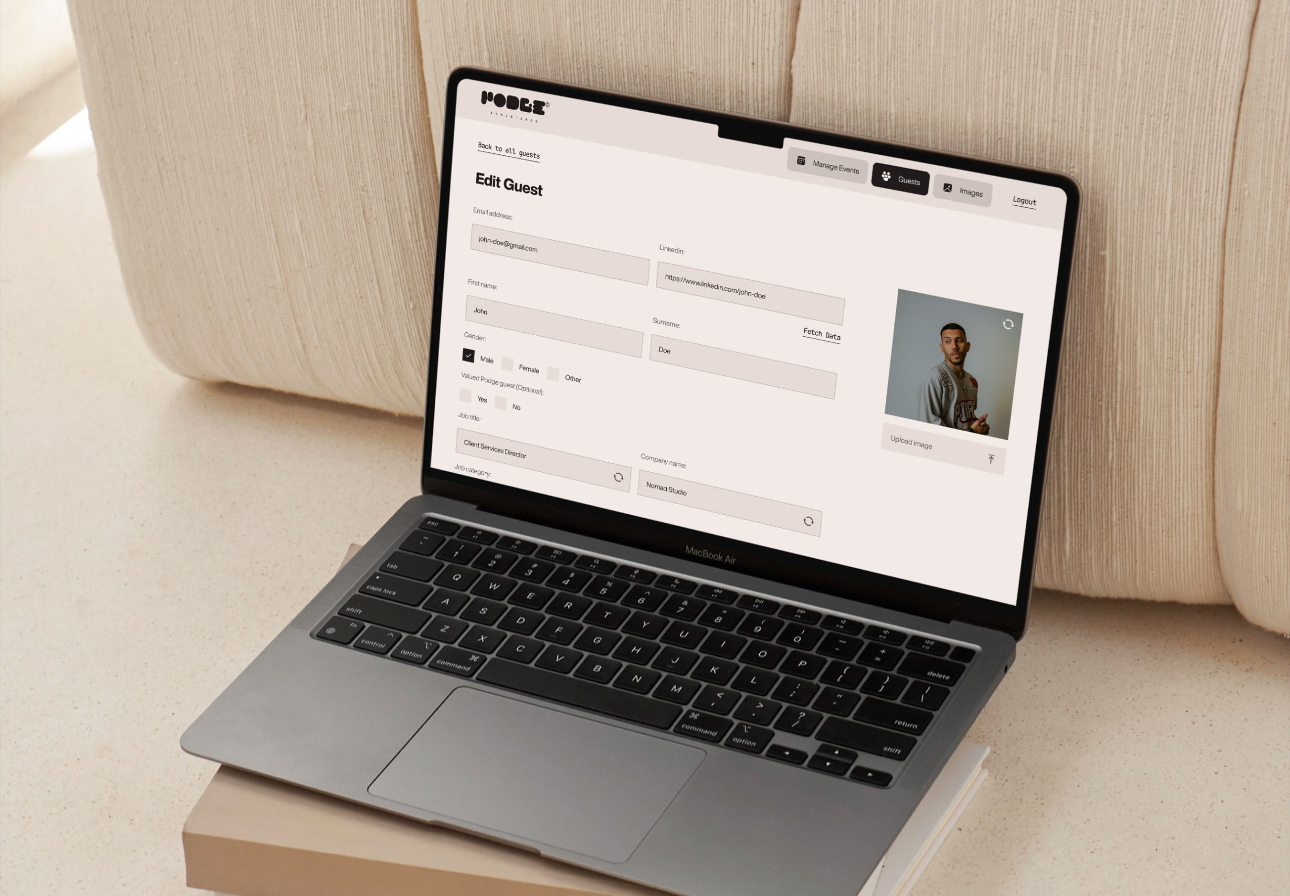 Laptop displaying guest management interface for event planning software.